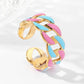 Anello Dorato Intrecciato con Smalto Rosa e Turchese